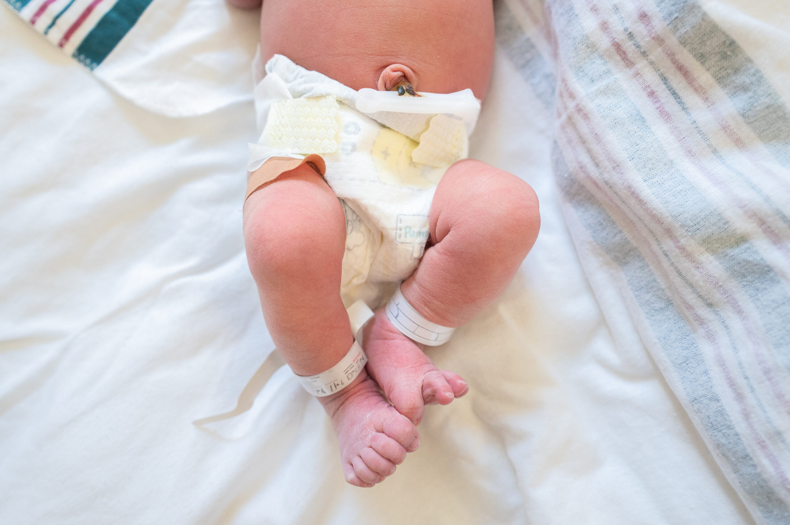 Baltimore newborn feet with hospital blanket during a fresh 48 session