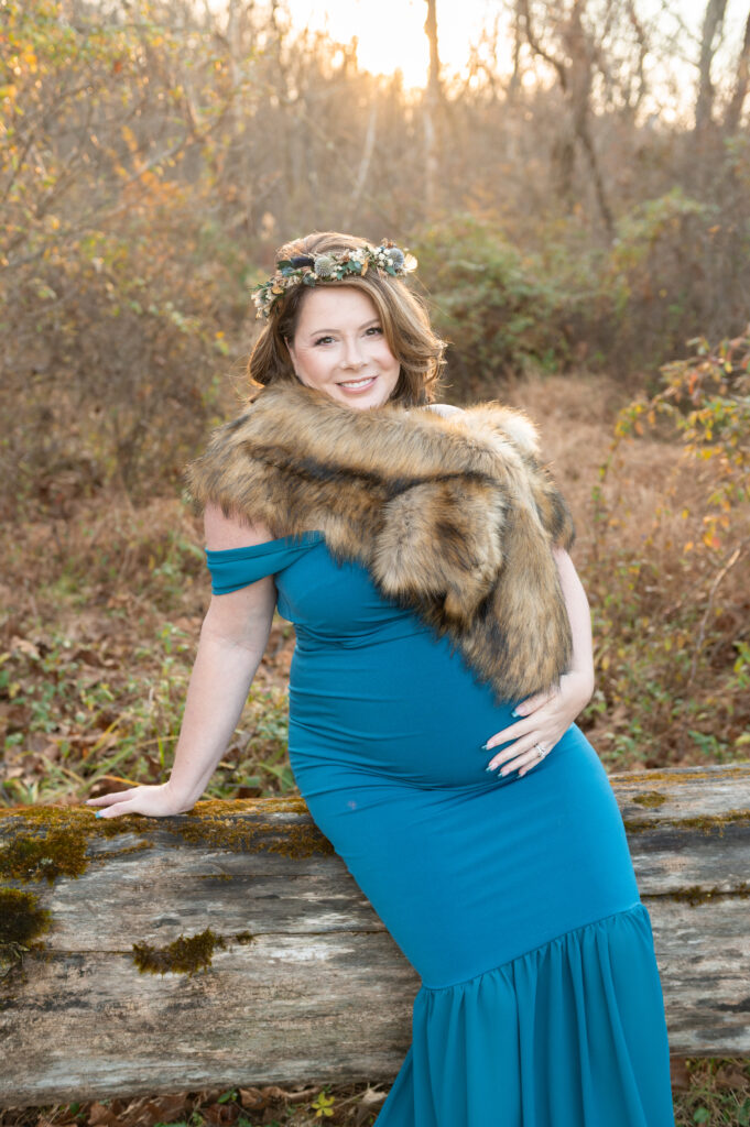 Expecting mother holding her belly during a maternity photoshoot in Baltimore Maryland